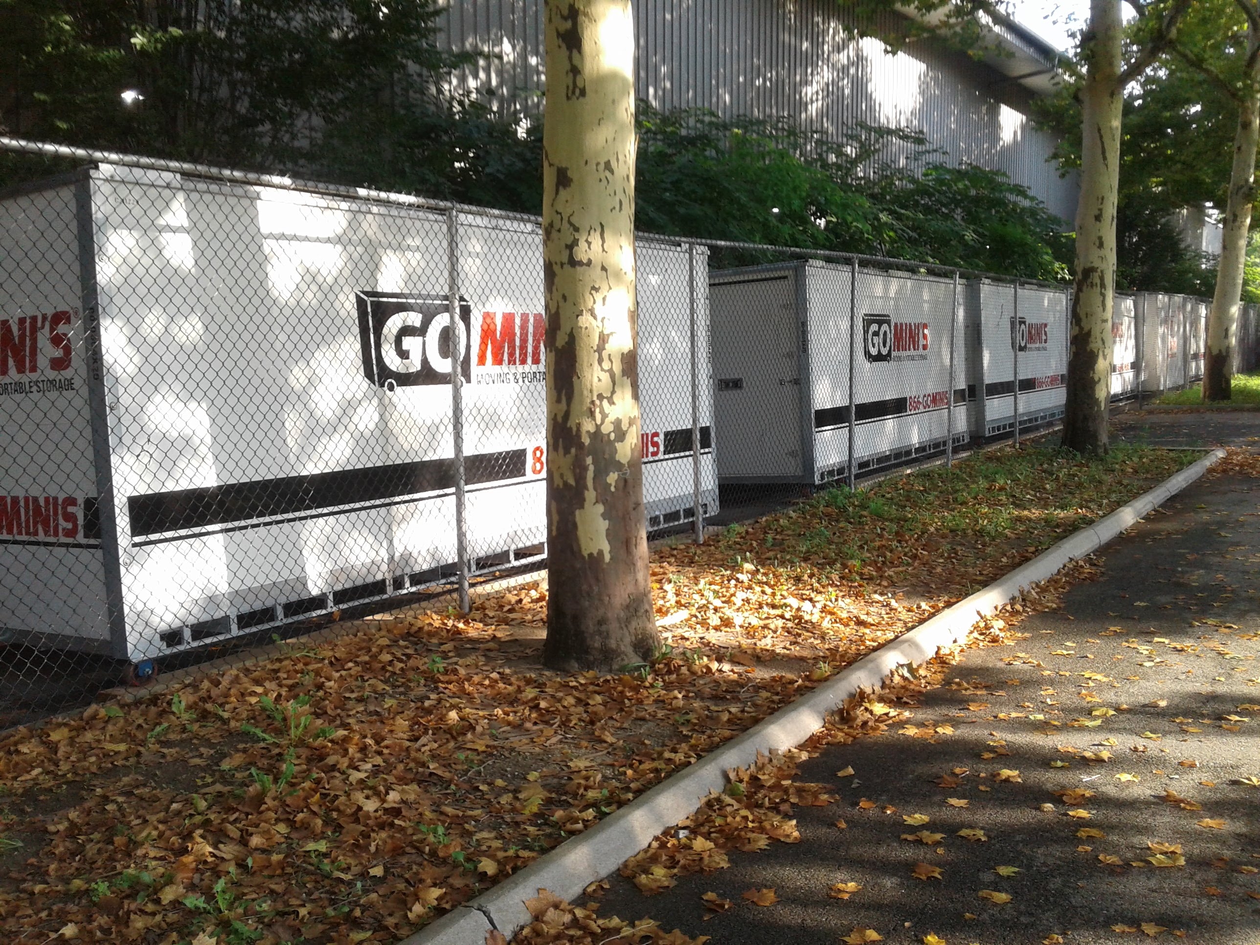 go minis moving containers behind fence